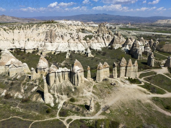 Striking rock needles line the wide valley in the Cappadocia region, aerial view, Love Valley,