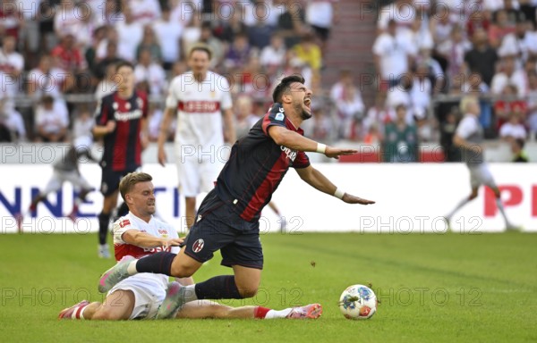 Tackle, action foul Maximilian Mittelstaedt VfB Stuttgart (07) v Riccardo Orsolini FC Bologna (07)