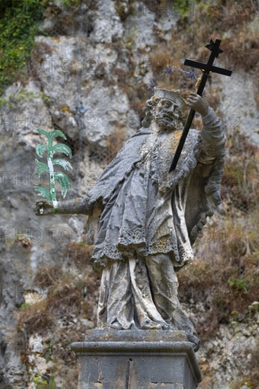 Sculpture of St Nepomuk in front of a rock face, Weltenburg, district of Kelheim, Lower Bavaria,