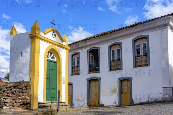 Small chapel and historic mansion on the streets of the city of Ouro Preto in, Ouro Preto, Minas