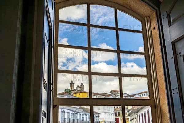 City of Ouro Preto seen through the window of an old colonial-style house, Ouro Preto, Minas