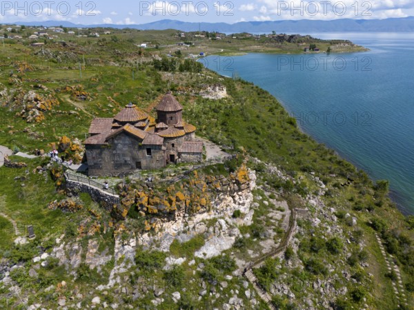Church perched above a magnificent lake with a panoramic view of the surrounding countryside,