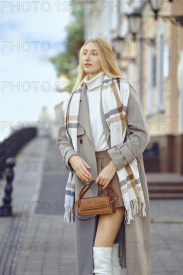 City portrait of a fashionable confident woman on a picturesque street lined with vintage