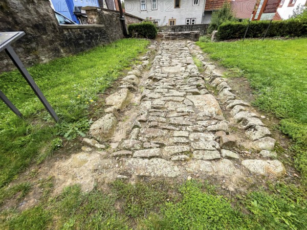Archaeological find of original small section with old stones from historic trade route between