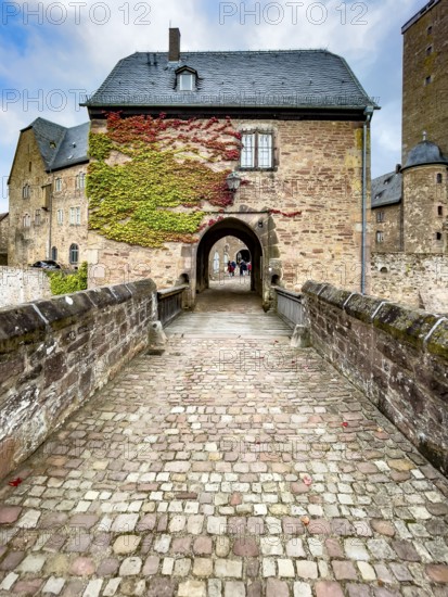 Front access with historic bridge over moat Hirschgraben to gatehouse of Steinau Castle, Steinau an