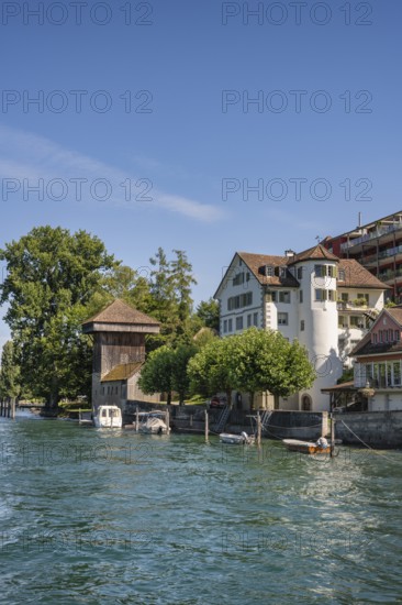 The banks of the Rhine in Diessenhofen with the historic wooden Hänkiturm tower, Canton Thurgau,