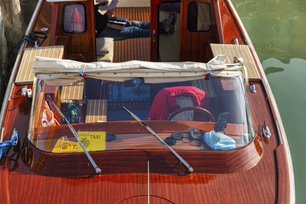 Water taxi, taxi boat, view from above, captain taking a break, Murano, group of islands in the