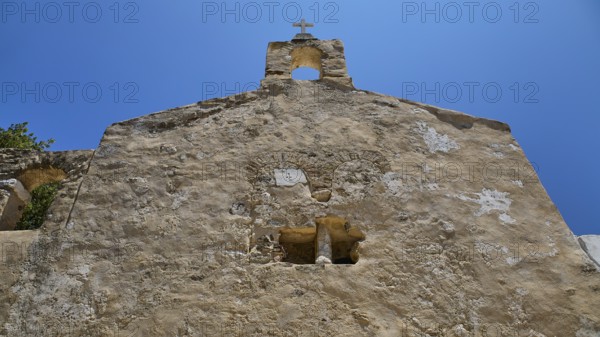 Detail of a stone church façade with architectural elements and steeple, Basilica, Church, Agios