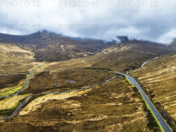 Eas a' Bhradain Waterfall from drone, Red Cuillin mountains, Loch Ainort, Isle of Skye, Scotland,