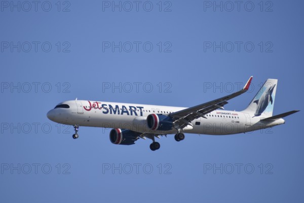 Aircraft Airbus A321 of the low-cost airline Jet Smart with picture of dolphin on the tail, seen in