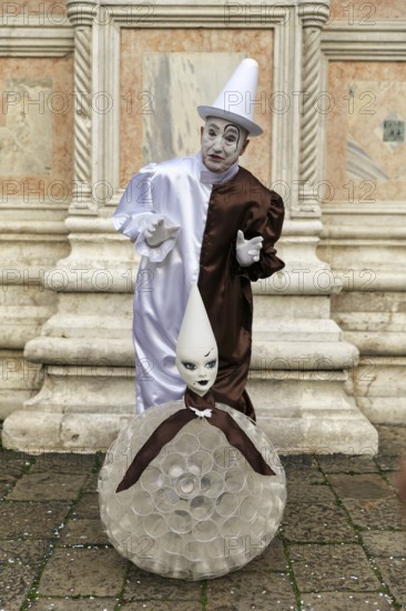 Pierrot, white painted face, conical hat, white clown, figure of the Commedia dell'arte,