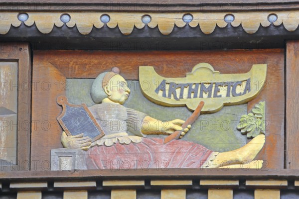 Allegorical woodcarving with figure on Arithmetica, Greek work with algebra, arithmetic,