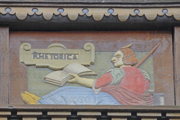 Allegorical woodcarving with figure on rhetoric, speaking, book, Renaissance, allegory, symbol,