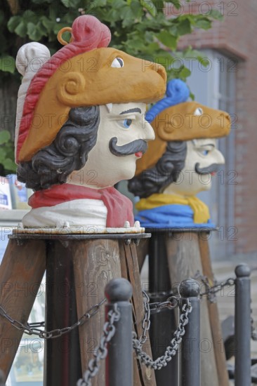 Colourful Swedish heads as landmarks, historical wooden head with face and four eyes, Swedish head