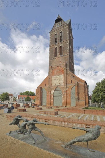 Sculpture Tug-of-War by Karl-Henning Seemann 1987 and Gothic, St Mary's Church tower without nave,