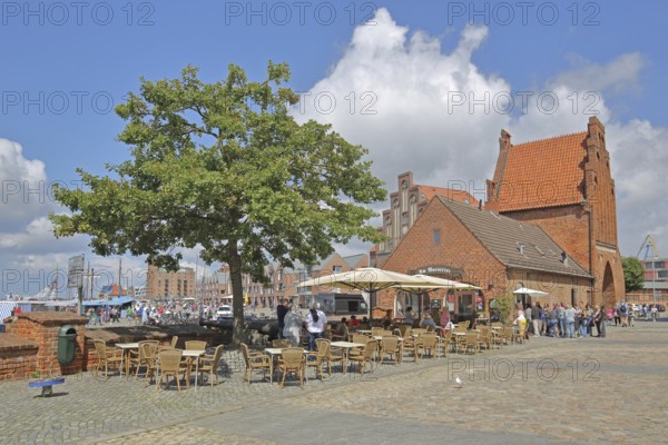 Historic water gate as part of the former town fortifications, street pub, restaurant, pedestrian,
