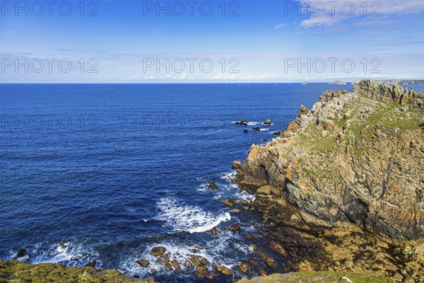 Rocky coast with a scenics sea view towards the horizon a sunny summer day by the sea, Crozon
