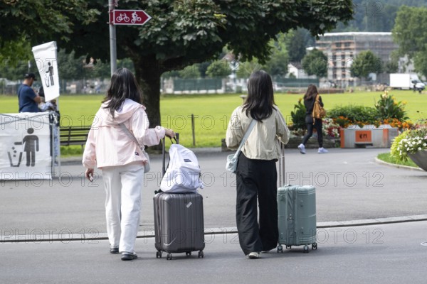 Tourists with luggage, Interlaken, Bern, Switzerland