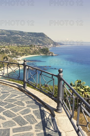 Viewing platform with railings offers a sweeping view of the coast and the sea, Ricadi, Capo