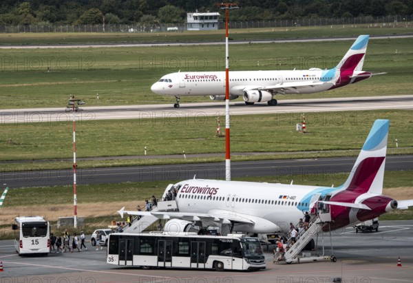 Düsseldorf Airport, Eurowings aircraft taking off, Eurowings Airbus on the apron, passengers