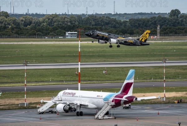 Düsseldorf Airport, Eurowings aircraft taking off, Eurowings Airbus on the apron, BVB Borussia