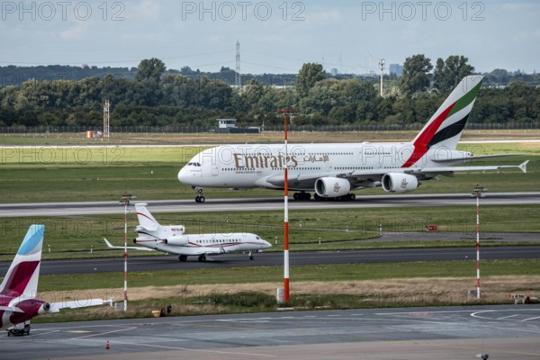 Düsseldorf Airport, Emirates Airbus A380-800, on take-off, Dassault Falcon 7X, of the American