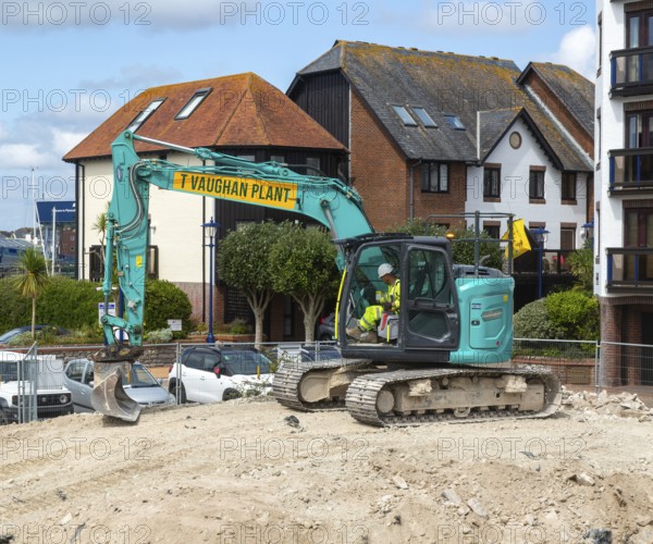 Kobelco long reach crawler tracked excavator vehicle on construction site, Millbank marina village,