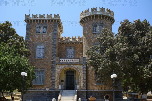 Bellinis Tower, Museum, Historical building with battlements and towers in front of a blue sky,