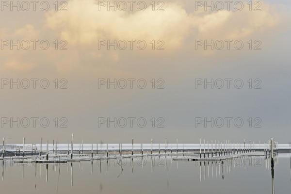 Winter day, onset of winter, snow on the jetties in the marina, North Sea, Norddeich, Lower Saxony,
