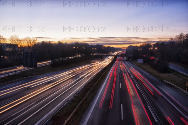 Motorway A96 at dusk and night with coloured lanes of moving cars. Munich, Bavaria, Germany