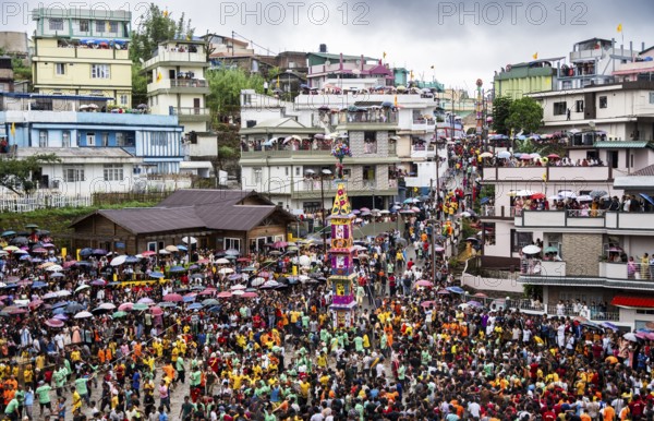 People from the Pnar community march in a circle around a Rot as they celebrate an event organised