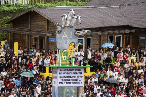 People from the Pnar community move around a Rot themed AI technology as they celebrate an event