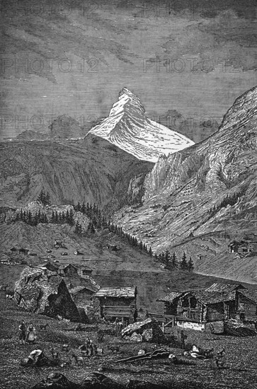 The famous Matterhorn, snow, alpine pasture, meadow with wooden huts, rocks, farmers, tourist