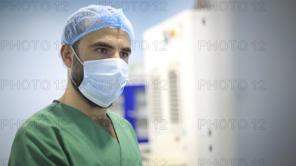 A patient and surgeon in the operating room during ophthalmic surgery