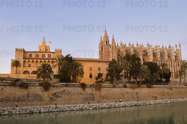 Cathedral La Seu or Cathedral of St Mary and Royal Palace La Almudaina in the evening light, Palma