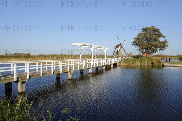 Historic windmill and drawbridge, UNESCO World Heritage Site, Kinderdijk, South Holland,