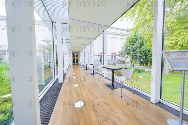 A modern café with glass walls and garden views, bright and open, Frieder Burda Museum, Baden