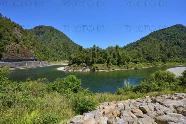 Clear river landscape surrounded by forested mountains and bright blue sky, Kilkenny Lookout, Lower