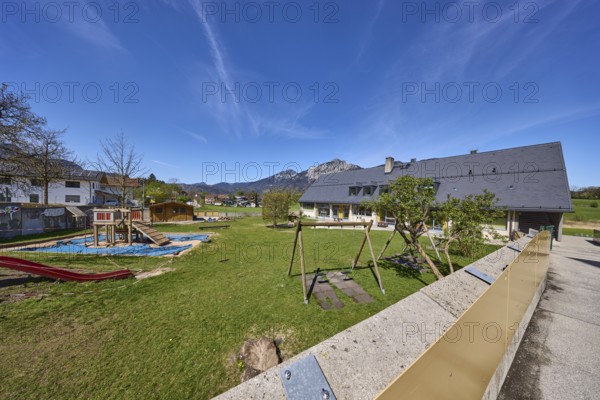 Catholic kindergarten St.Bruder Klaus, building, playground equipment, swing, sandpit, meadows,