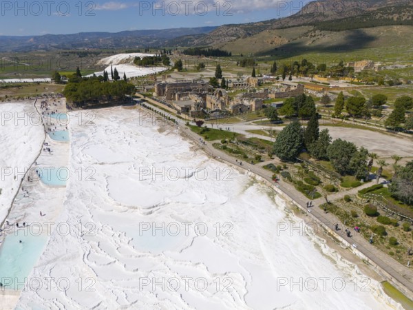Wide view over limestone terraces and ancient ruins in a picturesque landscape, aerial view, sinter