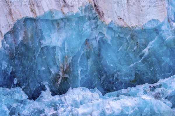 Blue ice structure of Fjortende Julibreen, 14th of July Glacier calving into Krossfjorden, Haakon