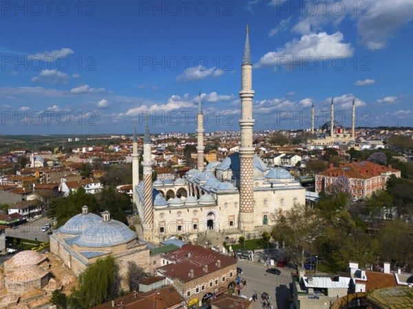 Impressive mosque with slender minarets surrounded by a city, aerial view, Mosque, Üç-Serefeli