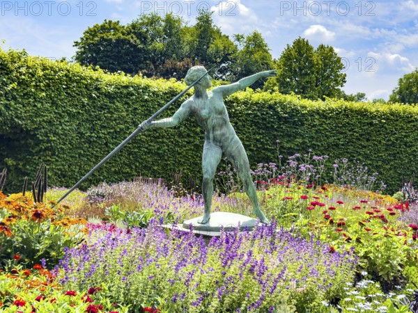 Sculpture Statue of bronze javelin thrower from 1937 by sculptor and artist Ernst Seger in flower
