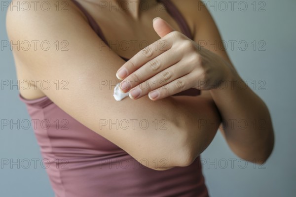 Woman applying moisturizing cream to arm. Concept for skincare and self-care routine. Generative