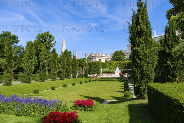 Vienna Volksgarten with a view of the famous Sisi Monument with the Town Hall Tower and the