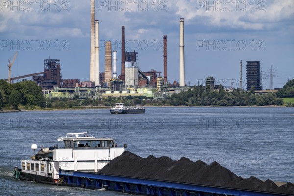 Industrial scenery of the ThyssenKrupp Steel steelworks in Duisburg-Bruckhausen, cargo ships on the