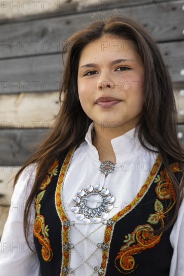 Young woman in traditional traditional costume at the reception for King Harald at the end of coal