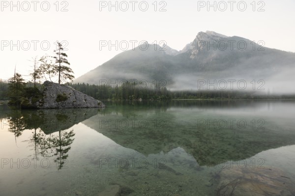 Magical sunrise with fog at Hintersee near Ramsau in Berchtesgadener Land