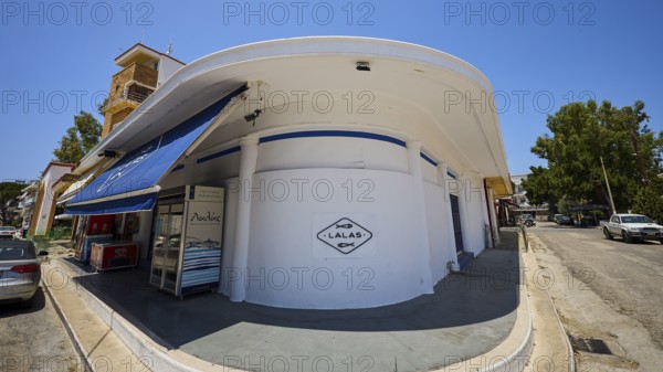 Fish market, Circular white building with blue awning, Street scene and shop signs, Armando