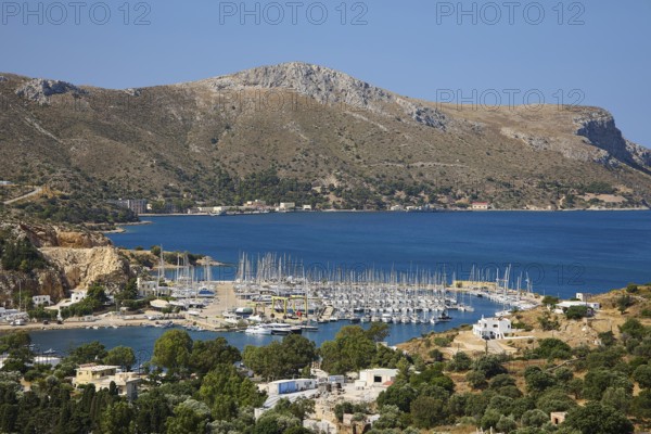 Panoramic view of a harbour full of sailing ships on a picturesque coastal landscape, Lakki, Leros,